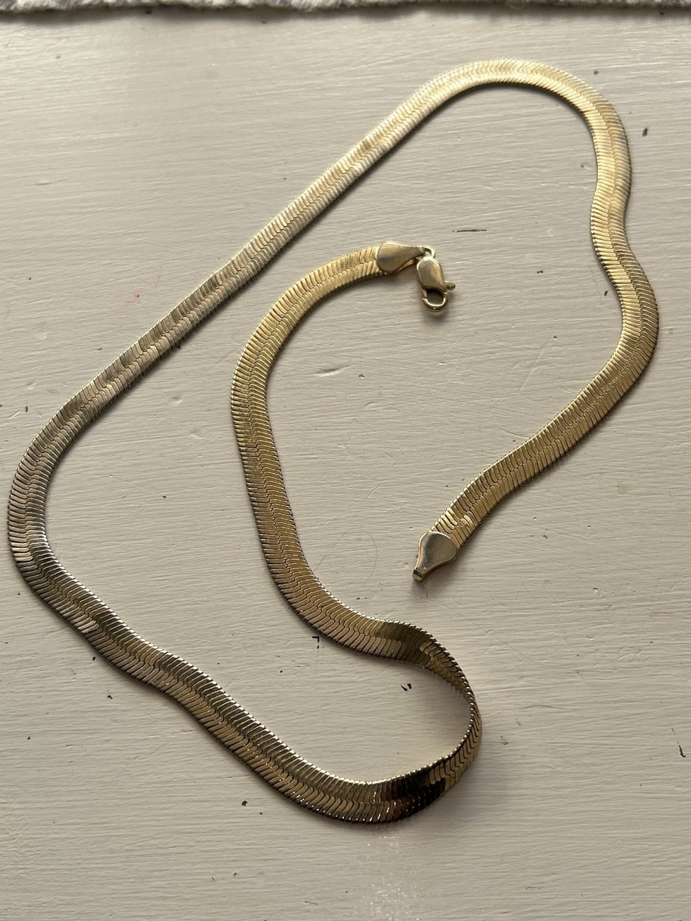 Unmarked gold tone wide herringbone necklace